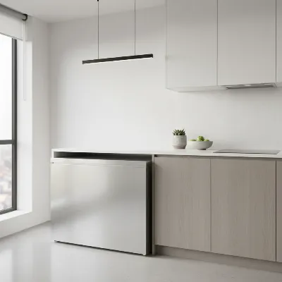 A compact chest freezer in a modern apartment kitchen, blending seamlessly with stainless steel appliances.